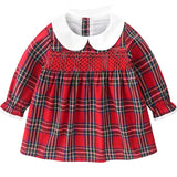 Red plaid dress with white collar on a white background